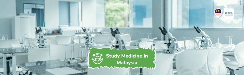 a modern scientific laboratory or classroom setting, for medical studies in Malaysia. There are several workstations equipped with microscopes and other laboratory equipment. The room has a clean, bright appearance with large windows allowing natural light.